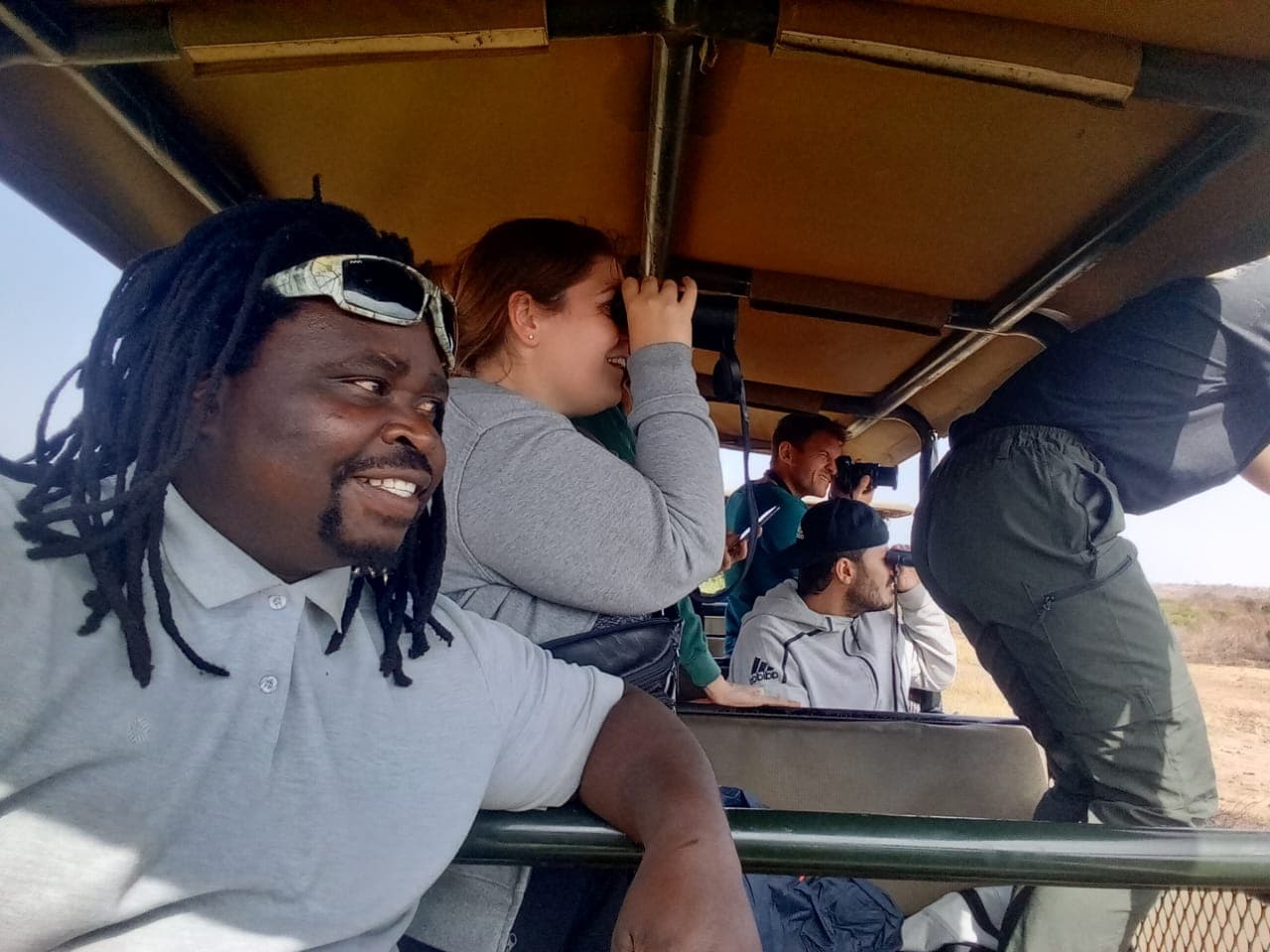 DIZA TRAVELS guide with guests on a Big 5 game drive in Hluhluwe-iMfolozi