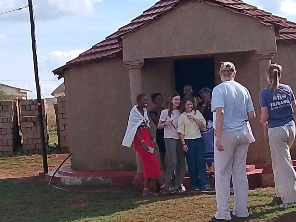 Homestead Stay — Zulu Cultural Immersion — Authentic Zulu homestead stay experience — guests with local community in Hluhluwe