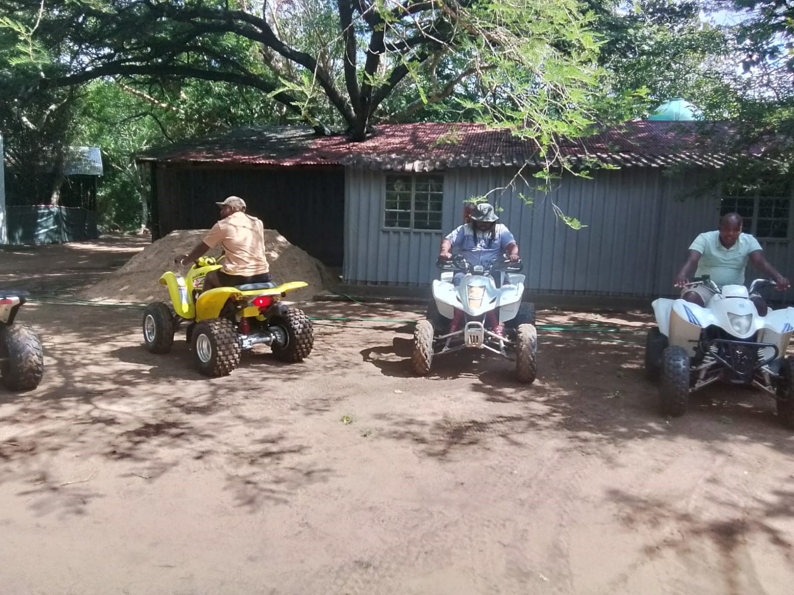 Quad Bike Adventure — Guests riding quad bikes on a guided off-road adventure near Hluhluwe